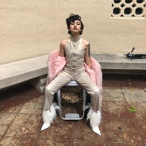 Gold shiny androgynous 80s glam rock high neck fitted zip front jumpsuit